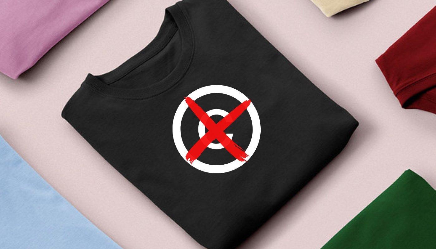 flat lay of t-shirts with a copyright symbol and x over t-shirt to emphasize copyright design standards